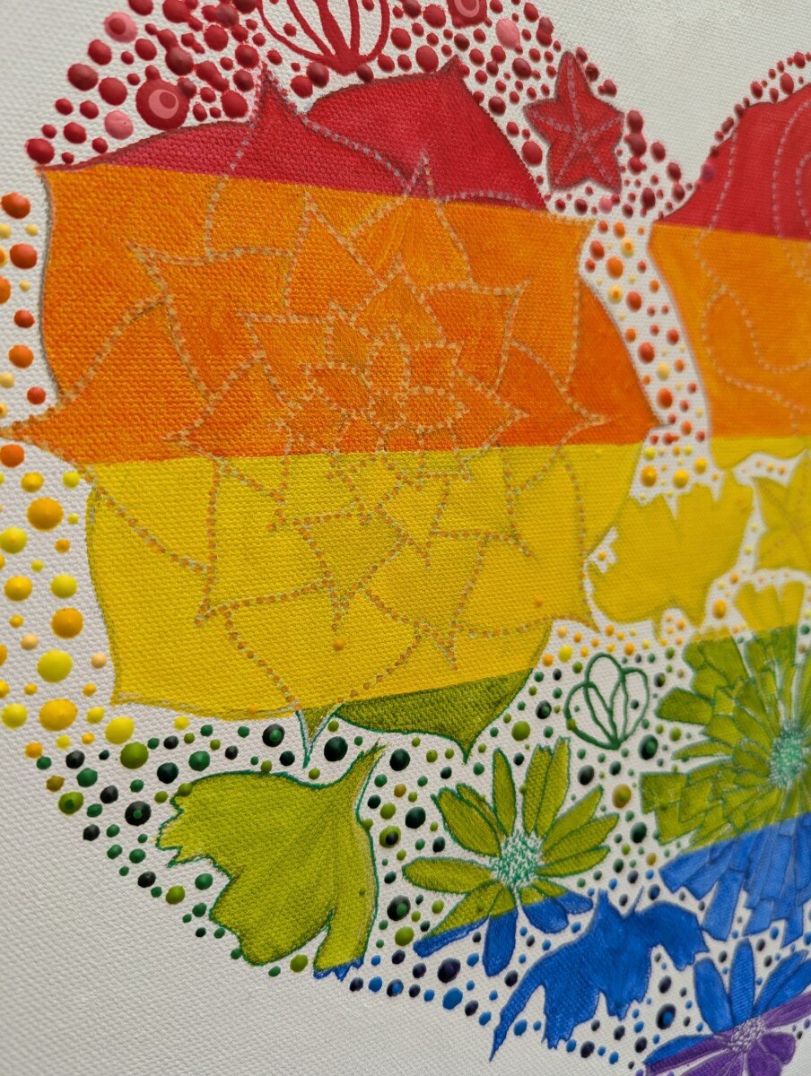 PXL_20251013_124326549 rainbow flag colour flowers in a heart shape